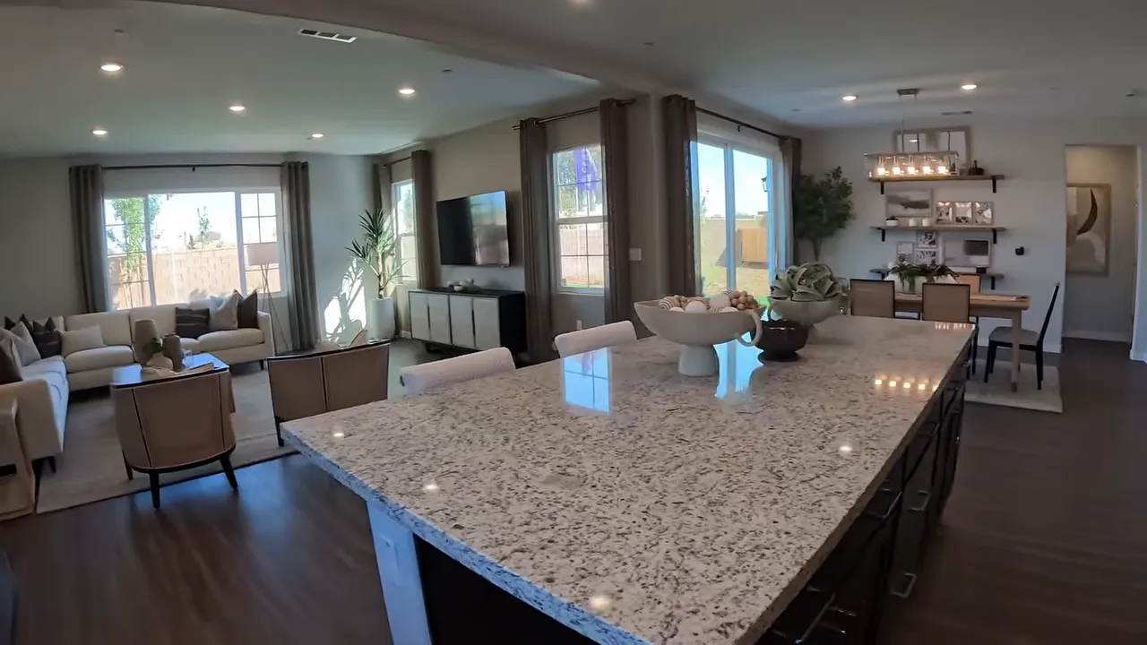 Kitchen with sink under window and large island