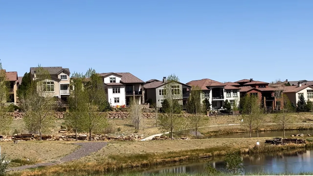 Residential patio home community with a pond and landscaped grounds in the Denver metro
