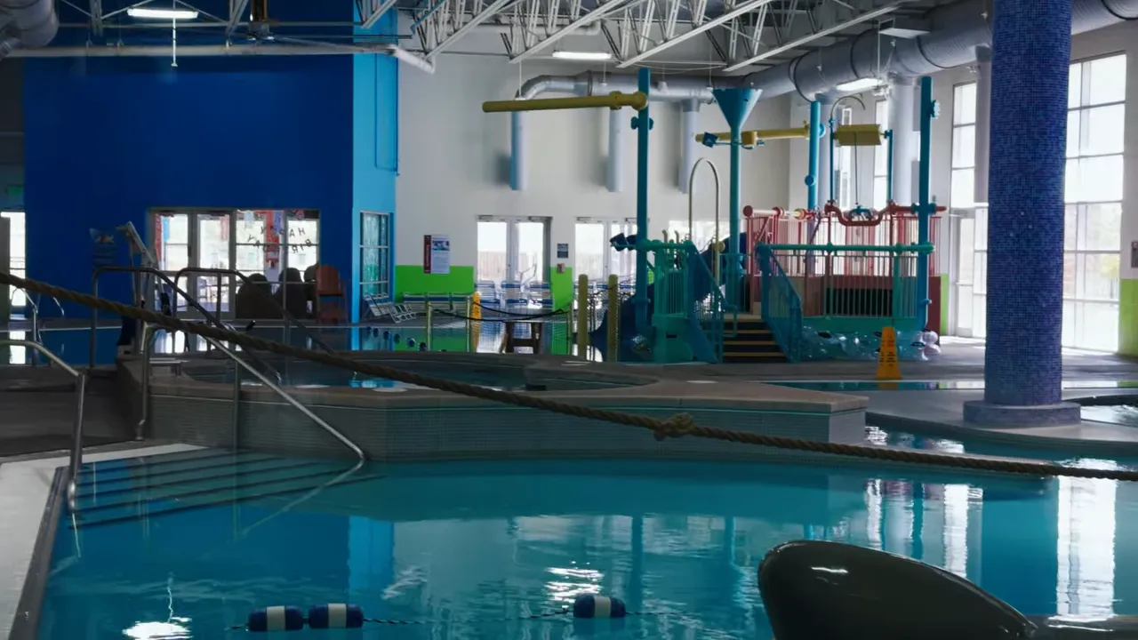 Indoor recreation pool area inside a Highlands Ranch family rec center
