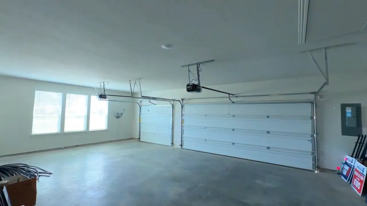 Spacious 3-car garage interior in a Blue Ridge TX no HOA home