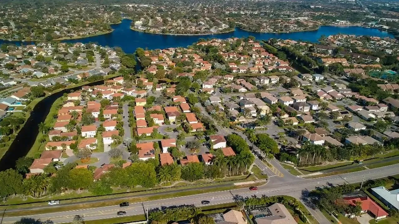 Aerial view of green spacious properties labeled Loxahatchee