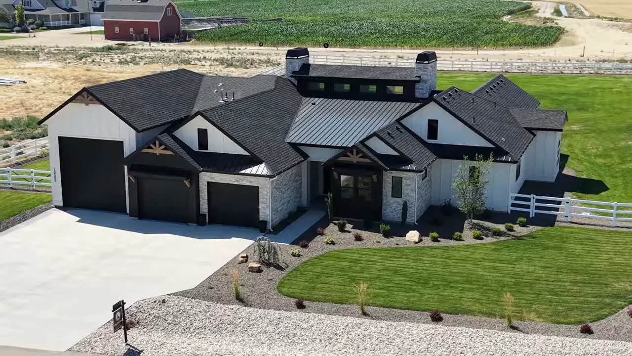 Aerial view of house with on-screen price of 1349900 dollars