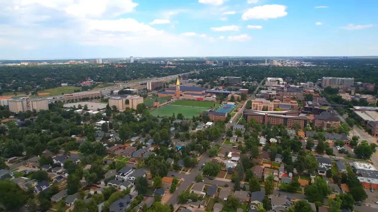 Aerial view of Denver cityscape with residential neighborhoods and parks