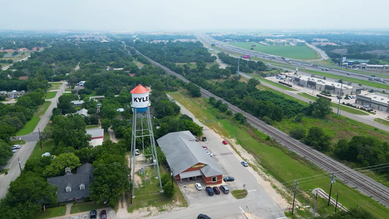 Aerial view of Kyle Texas with a water tower and roads through the neighborhood