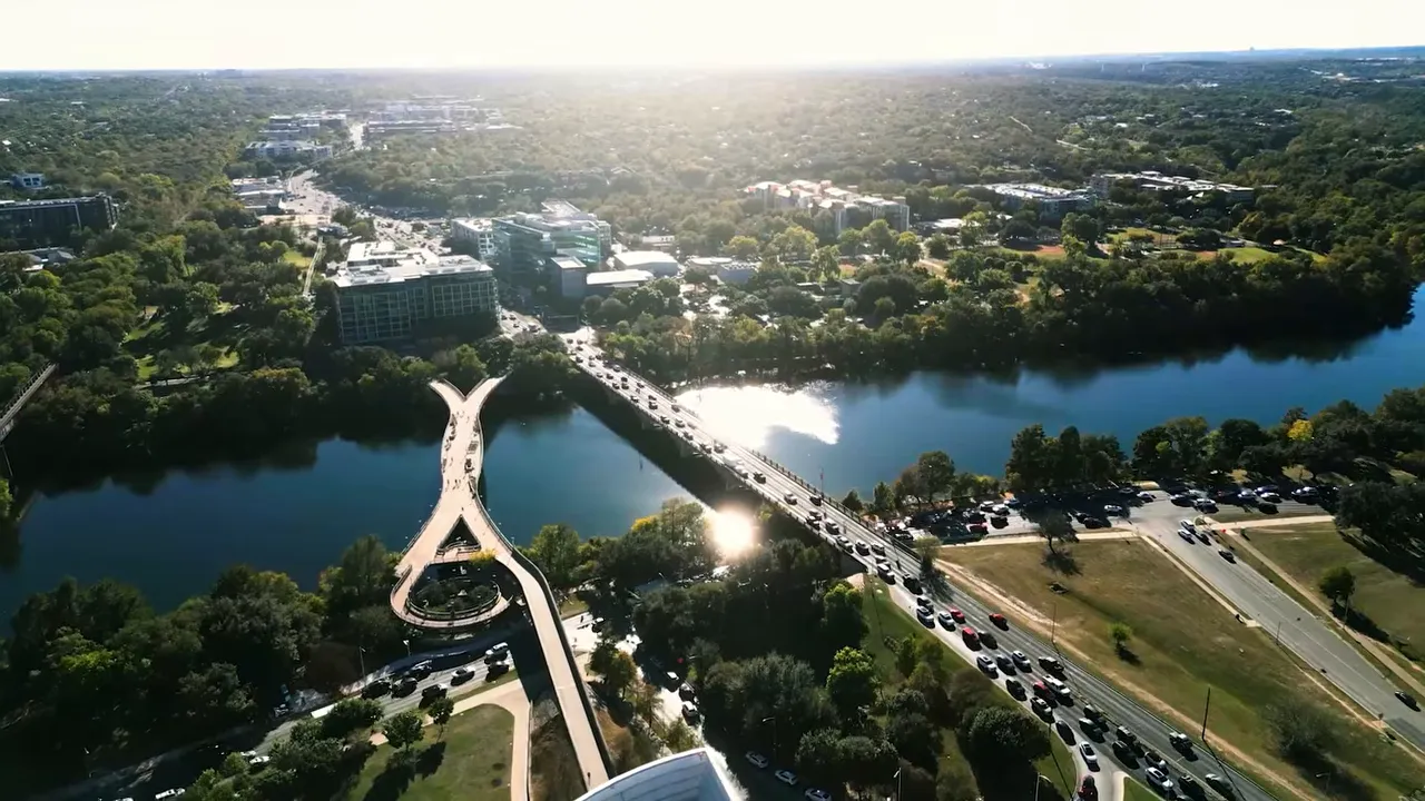 Aerial view of Austin Texas with bridges over the river and surrounding neighborhoods