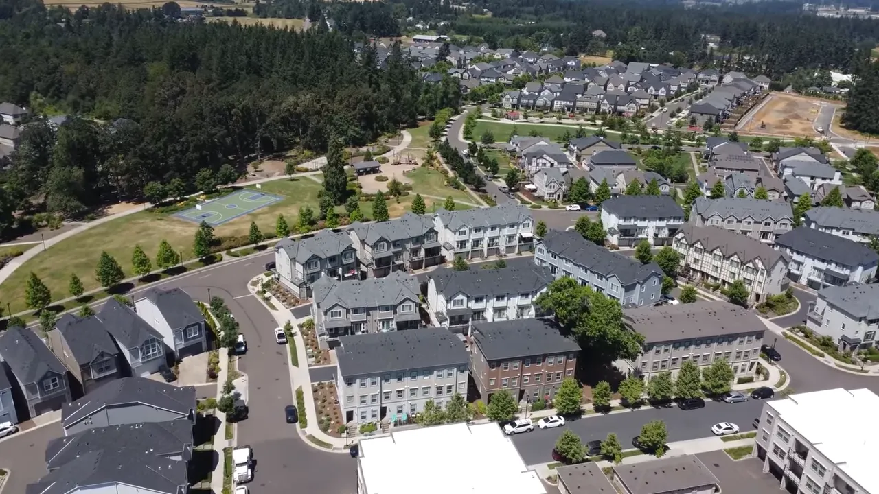 Large new construction community with townhomes apartments and streets laid out in a master planned area