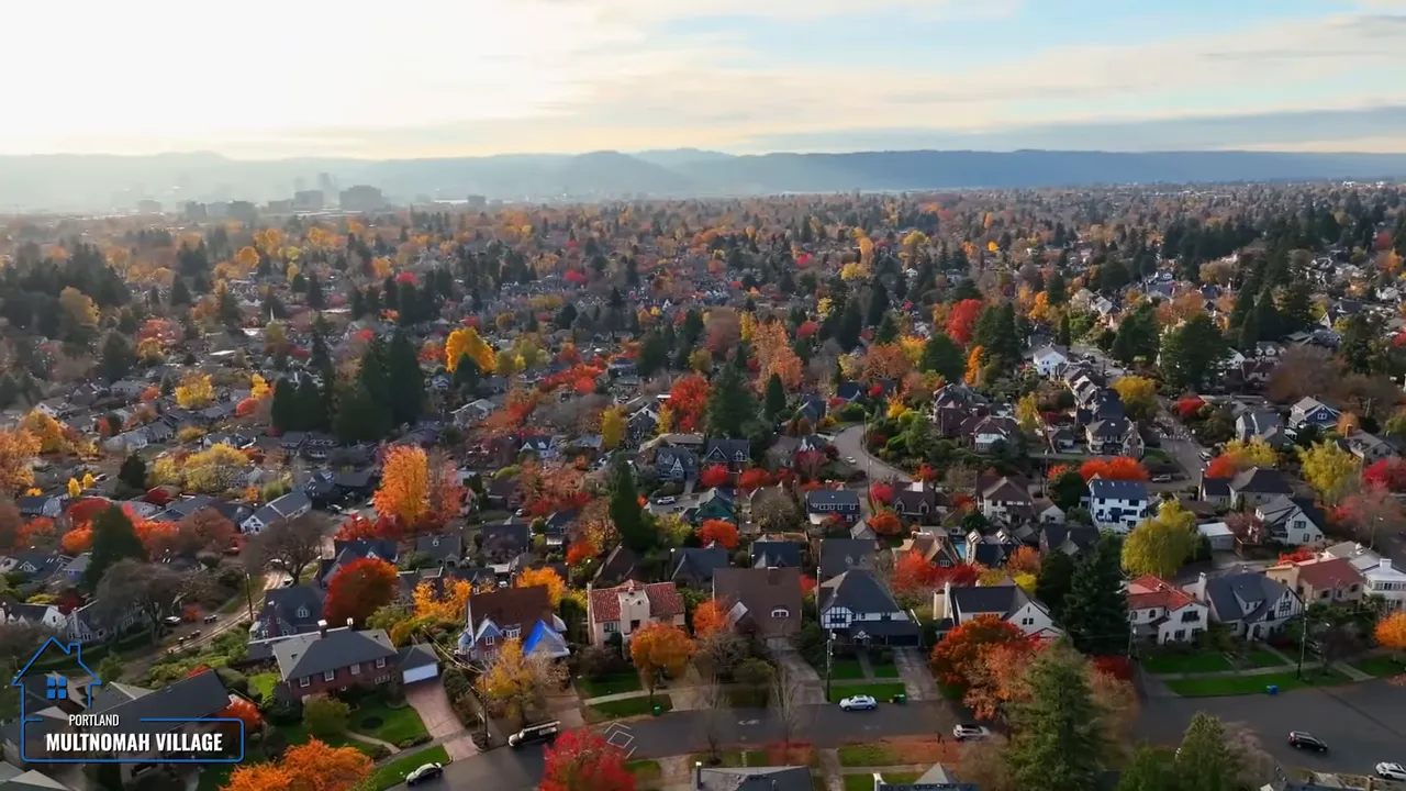 Aerial view of Multnomah Village neighborhood with dense homes and colorful trees