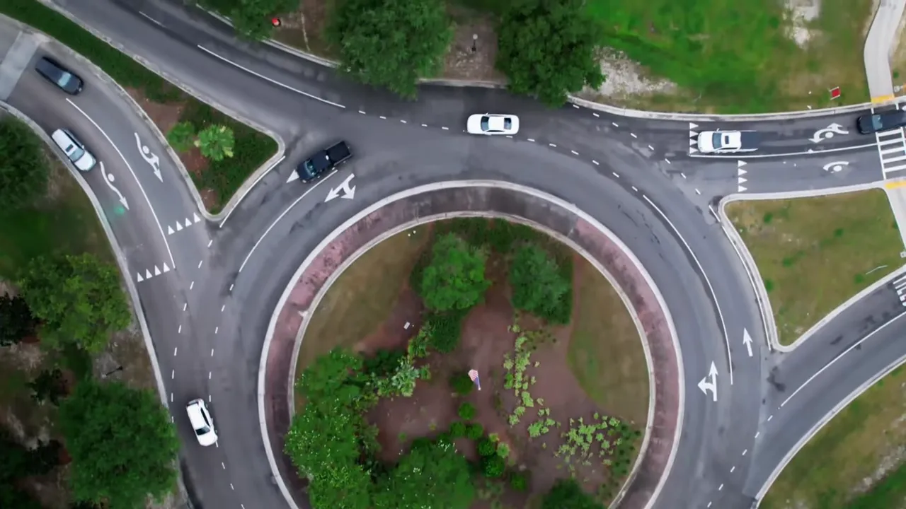 Busy roundabout with multiple lanes of traffic