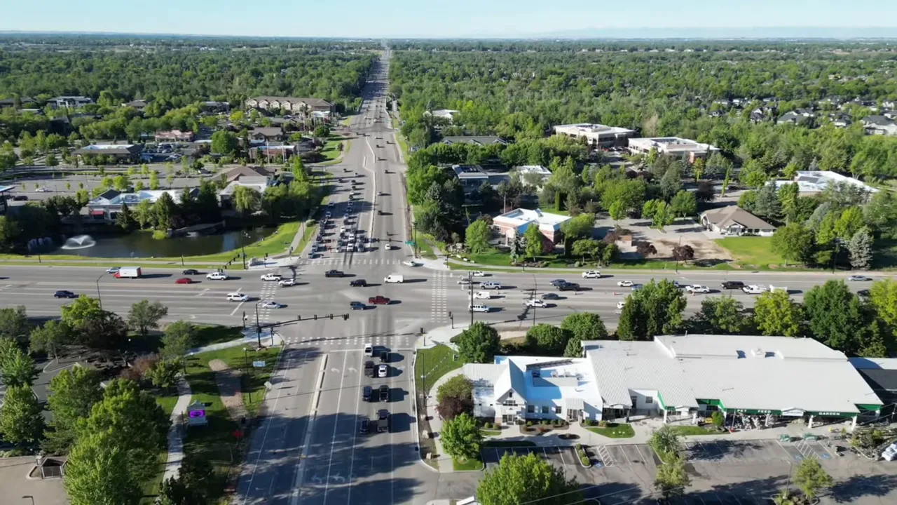 Aerial view of Eagle Idaho neighborhood streets and businesses along a major corridor