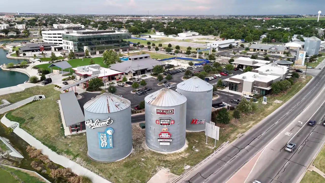 Aerial view of Hutto Texas shopping and dining complex near the highway