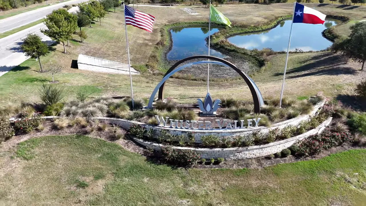 Whisper Valley neighborhood entrance sign at Winter Valley in Manor Texas