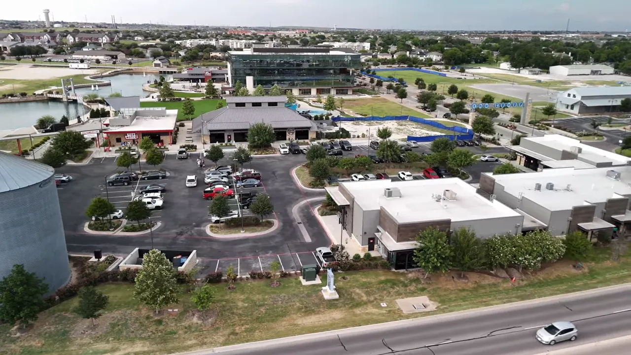 Aerial shot of Hutto Texas main community center and retail area with parking and roads