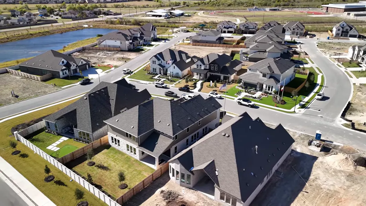 Aerial view of new homes and neighborhood streets in Pflugerville, Texas