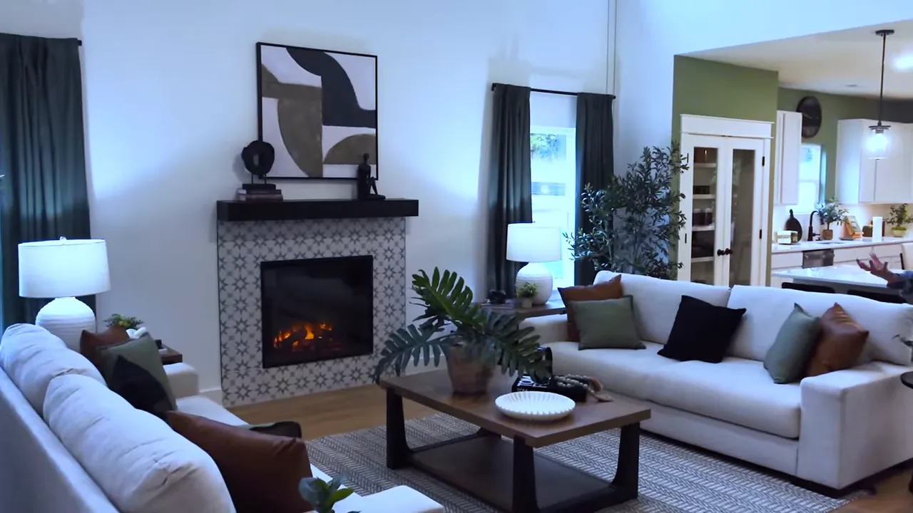 Great room with tall ceilings fireplace and white seating