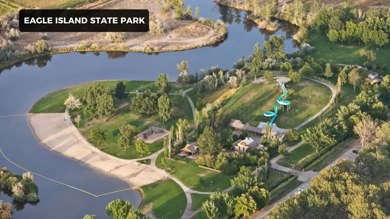 Aerial view of Eagle Island State Park with river, green spaces, and outdoor recreational area
