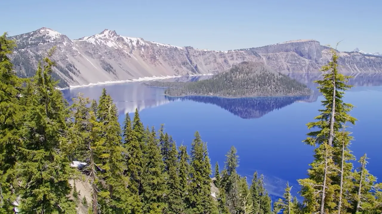 Wide view of Crater Lake with blue water and rim cliffs