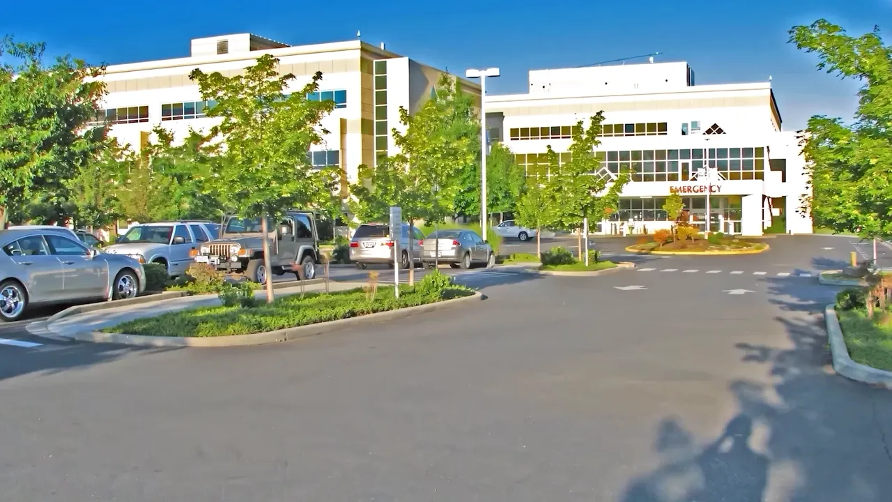 Hospital campus with parking area and modern medical building