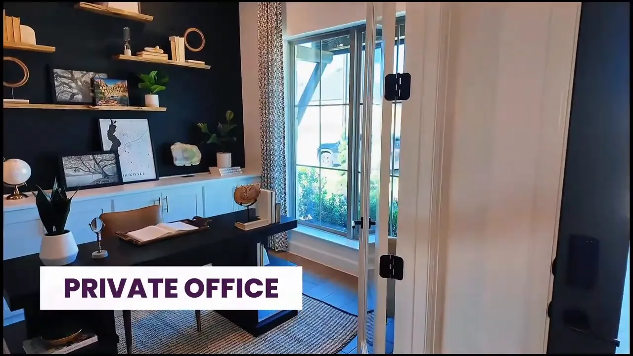 Private office with dark accent wall desk built in cabinets and large front window