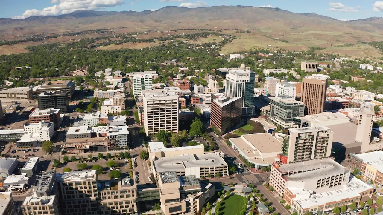 Aerial view of downtown Boise with mountains in the background