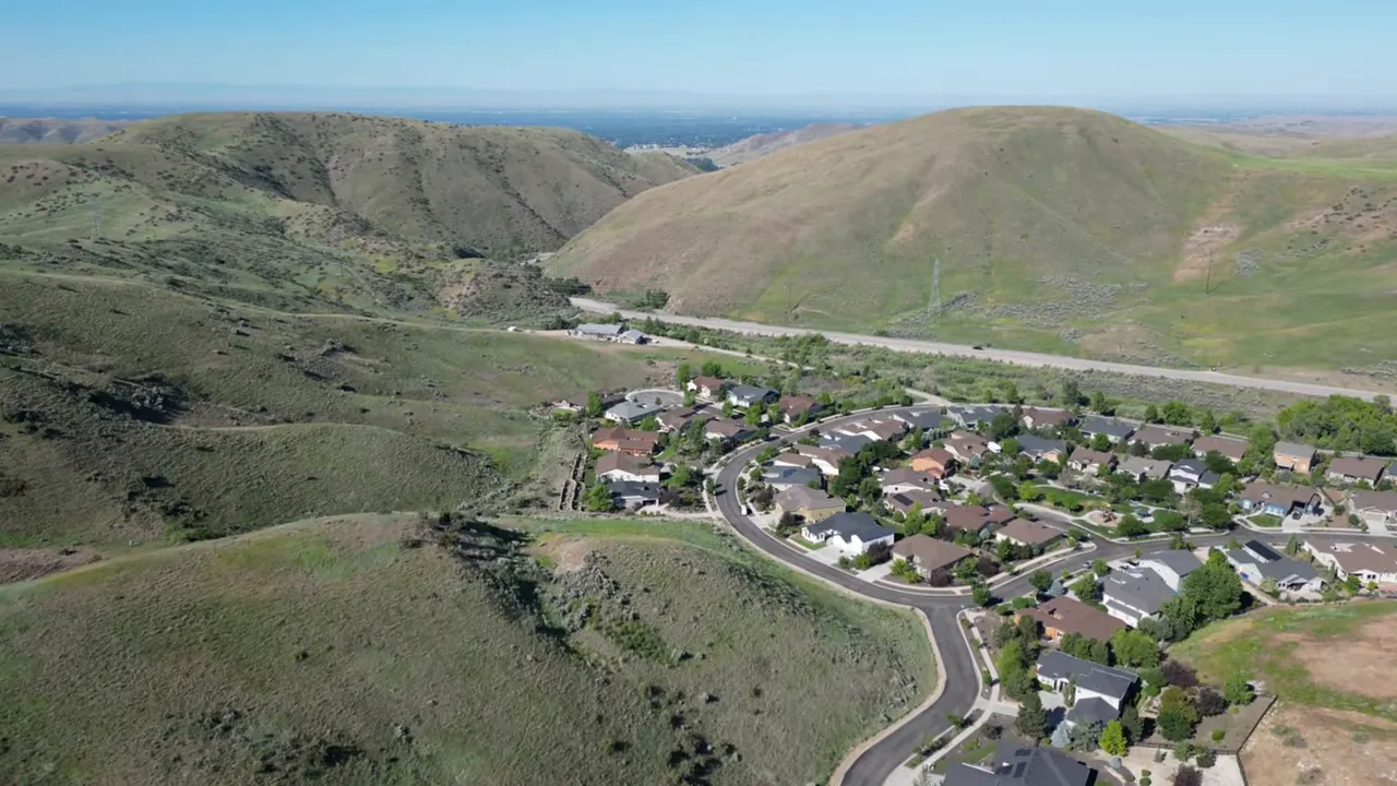Aerial view of homes in Avimor-style foothills terrain near Eagle, Idaho