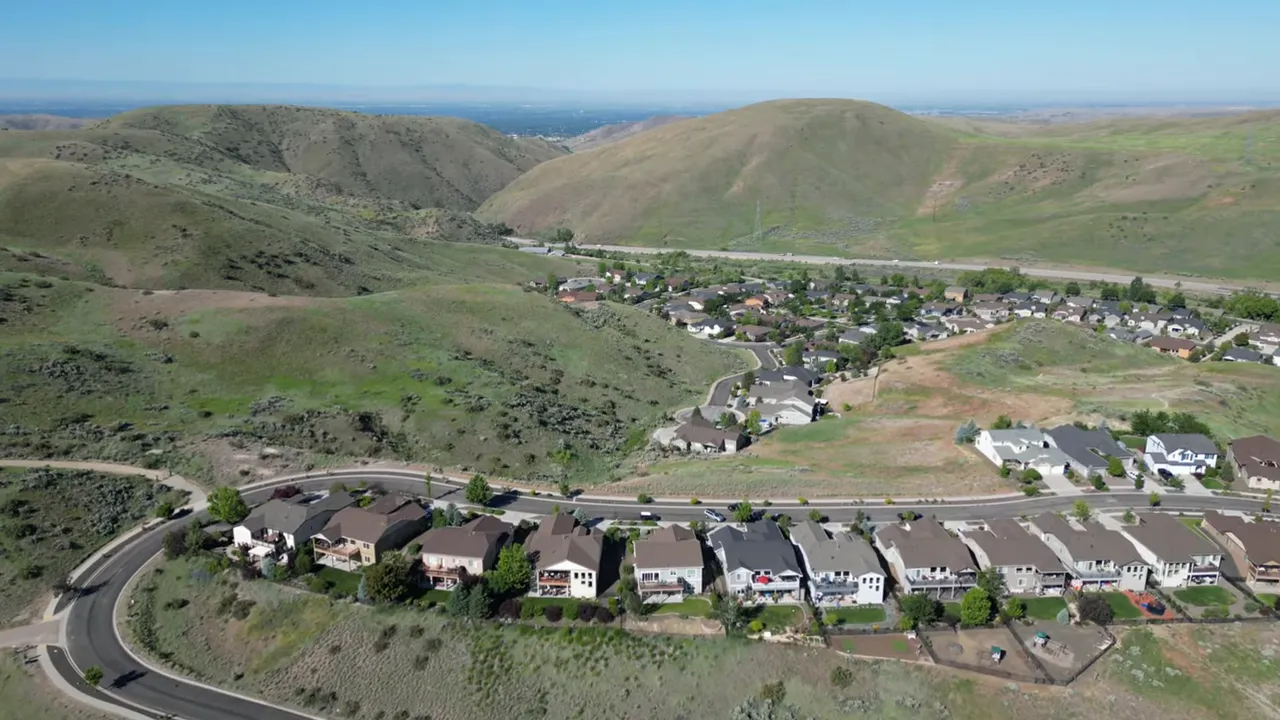Aerial view of homes in the Eagle Idaho foothills with surrounding hills and valleys