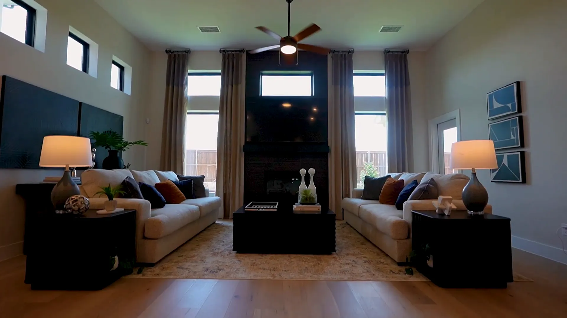 Open living area with high ceilings and fireplace