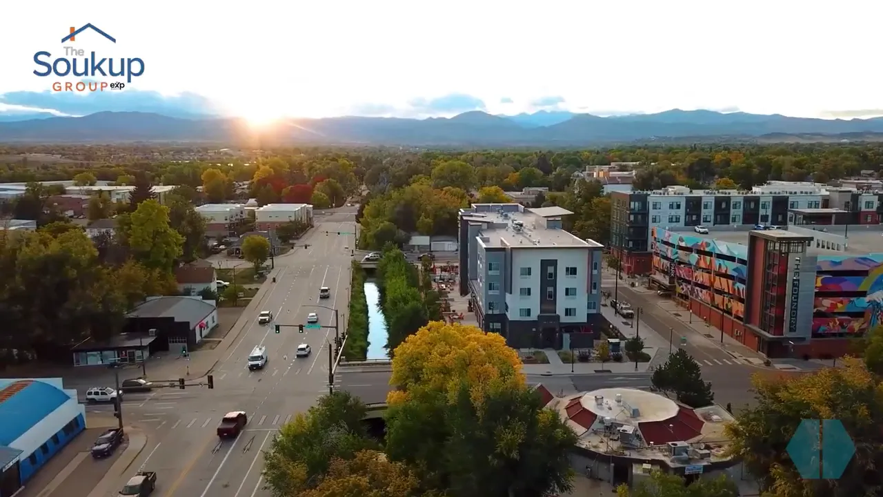 Aerial view looking down a tree lined street through downtown Loveland