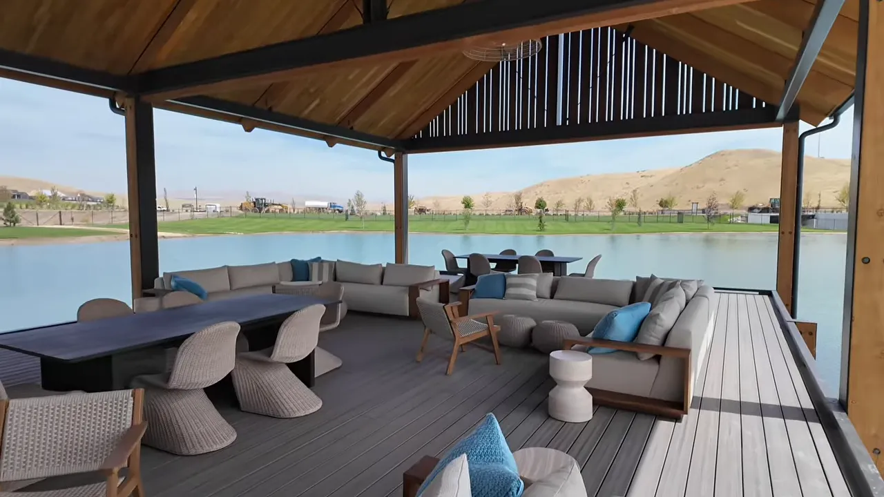 Covered waterfront pavilion with sofas and lake views