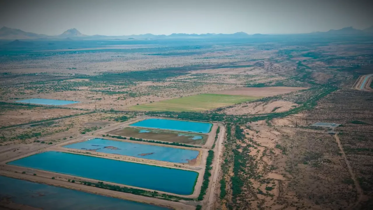 Aerial view of a large water facility in a desert landscape