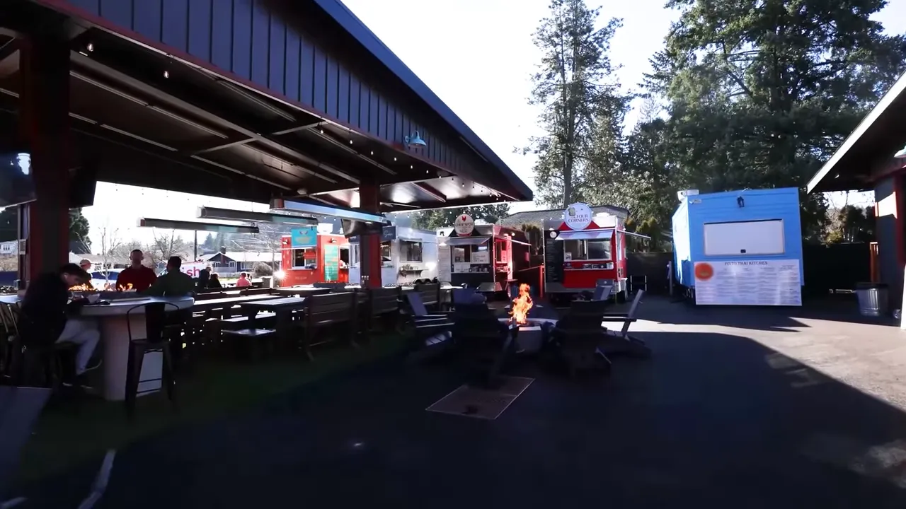 Covered food cart seating area at Willamette Garage