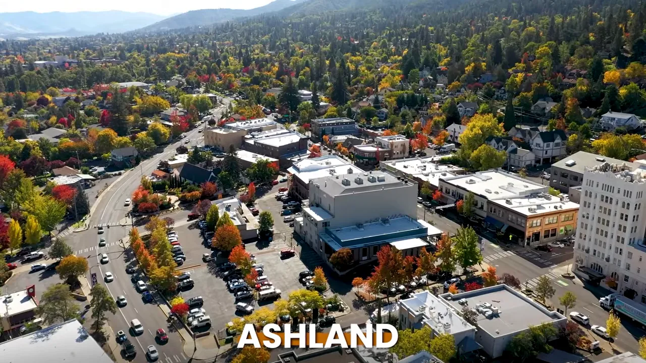 Aerial view of downtown Ashland surrounded by forested hills