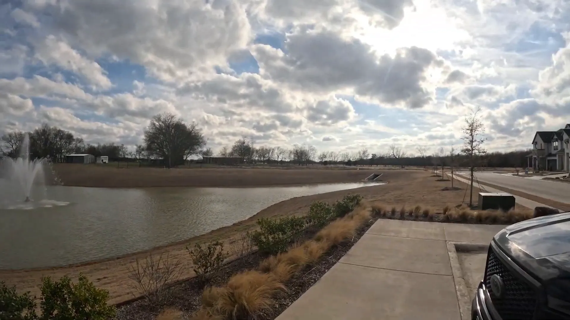 Pond and landscaped walking path at Creek Side