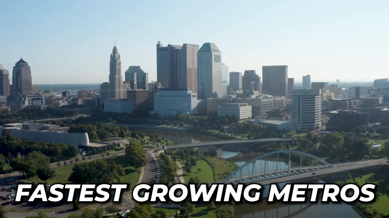Aerial view of downtown Columbus skyline and riverfront highways