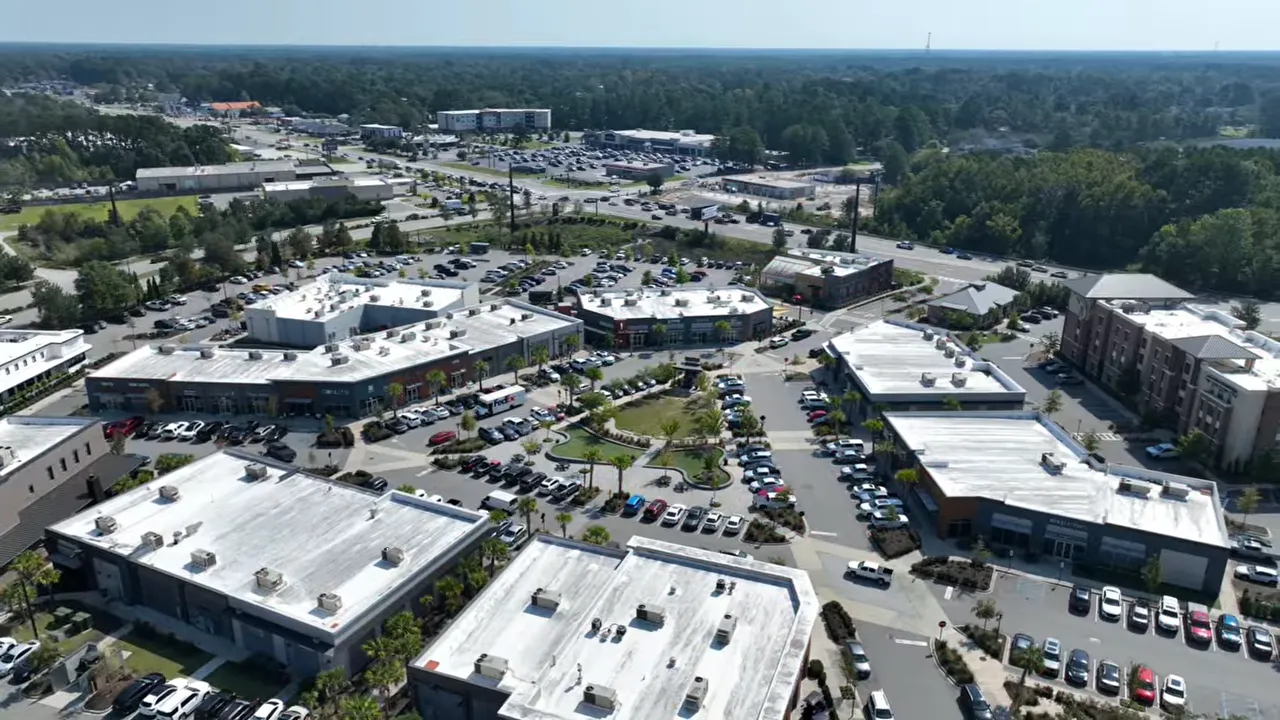 Aerial view of Nexton’s retail and dining district with parking areas and connected streetscapes