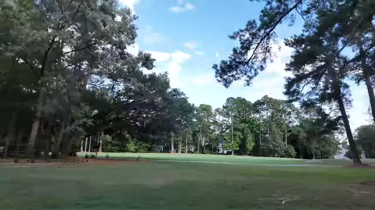 Green golf fairway framed by mature trees at Legend Oaks Plantation in Summerville SC