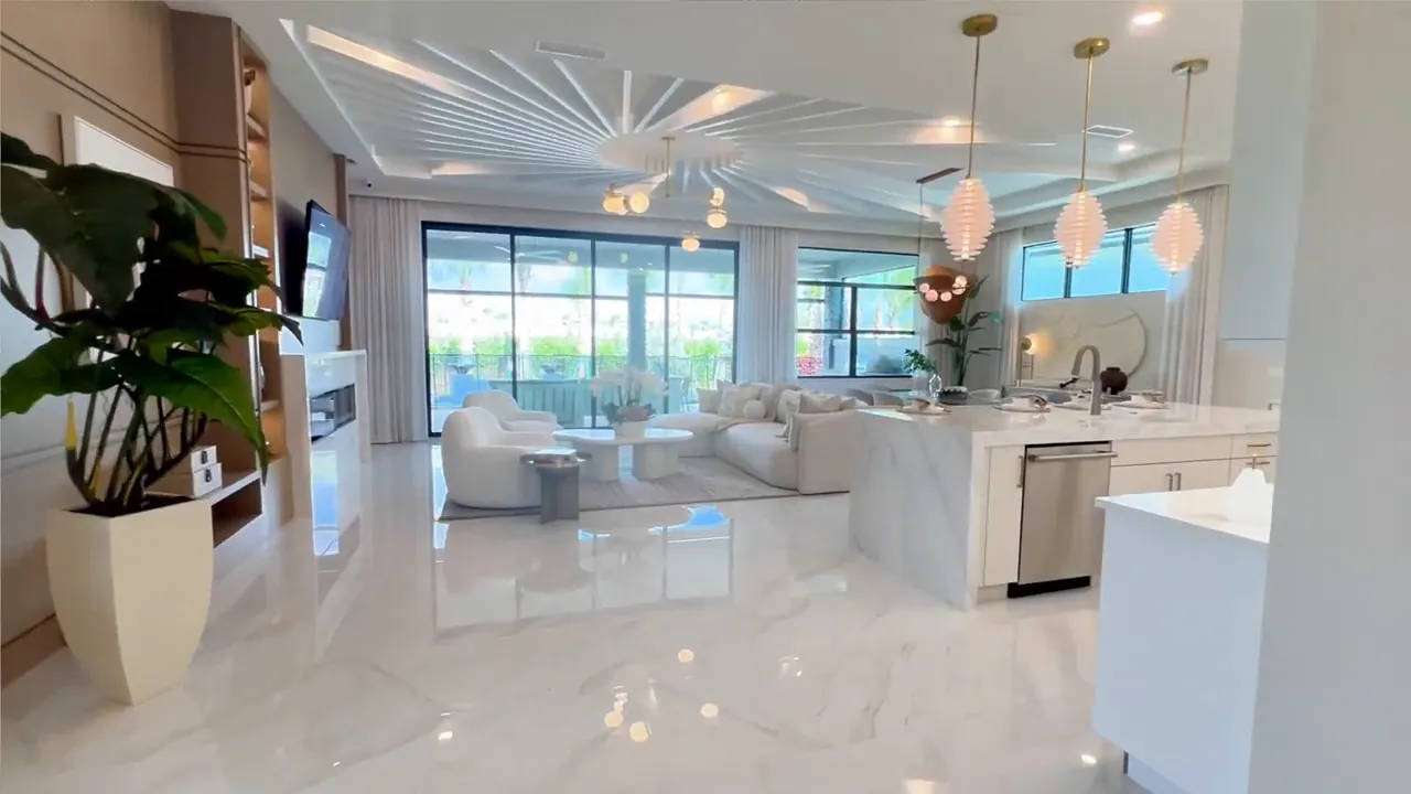 Open Sophia model living room kitchen and dining area with white finishes