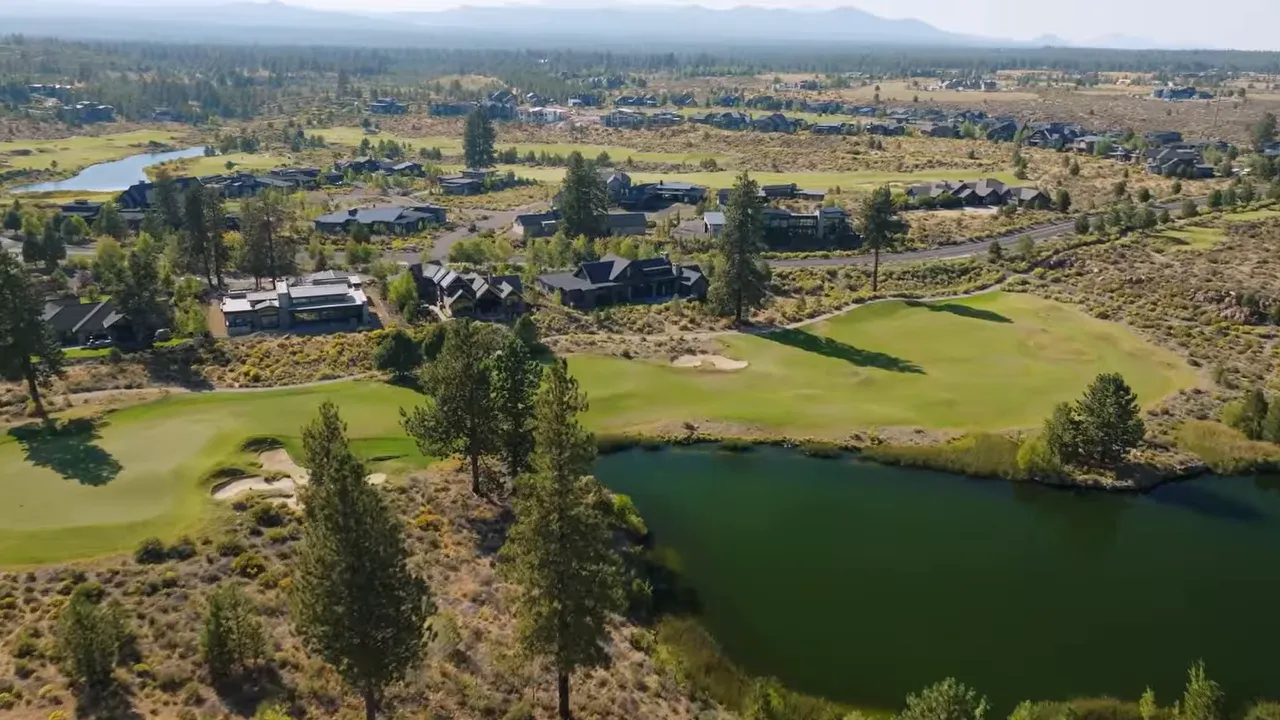 Tetherow aerial view of golf fairway and pond with Bend Oregon homes