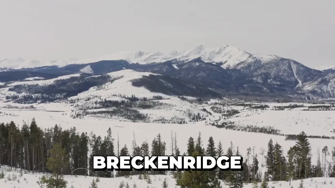 Snow covered mountain landscape with the word Breckenridge on screen
