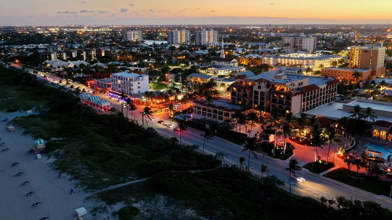 Aerial dusk view of Delray Beach showing Atlantic Avenue, beachfront and nearby hotels