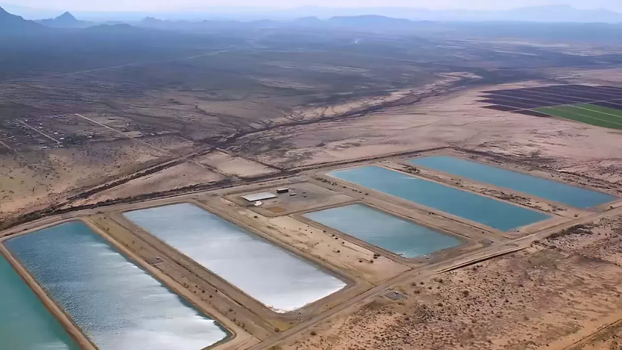 Aerial view of desert water storage and canal infrastructure in Arizona
