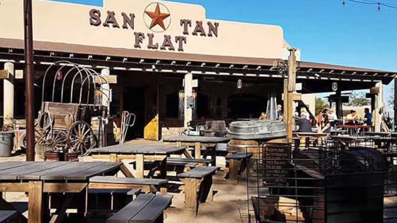 San Tan Flat restaurant exterior with patio tables rustic decor and western style signage