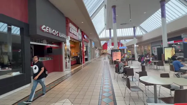 Indoor shopping center with Target sign and illuminated carousel