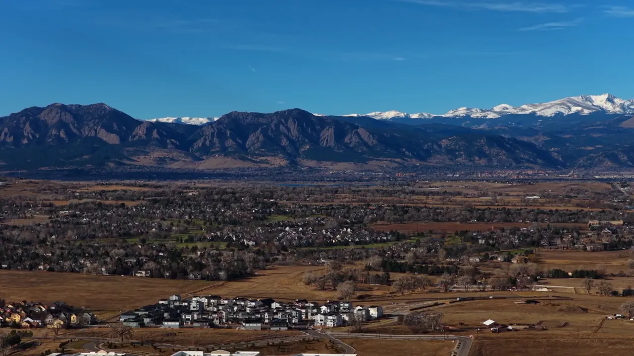 Panoramic aerial view of Northern Colorado neighborhood with Rocky Mountains