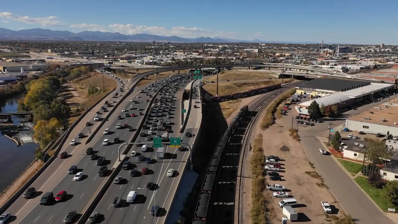 Aerial view of a major highway and interchange showing lanes of traffic in Northern Colorado