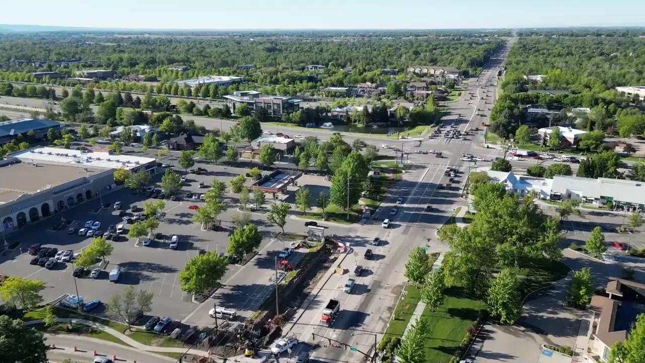 Aerial views labeled Meridian and Kuna over suburban development and roads