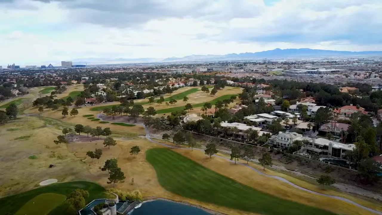 Aerial view of Spanish Trail golf course with lakes and homes