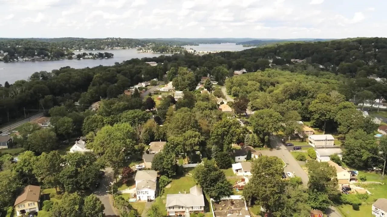 Aerial view showing wooded residential areas near Lake Hopatcong in Roxbury Landing