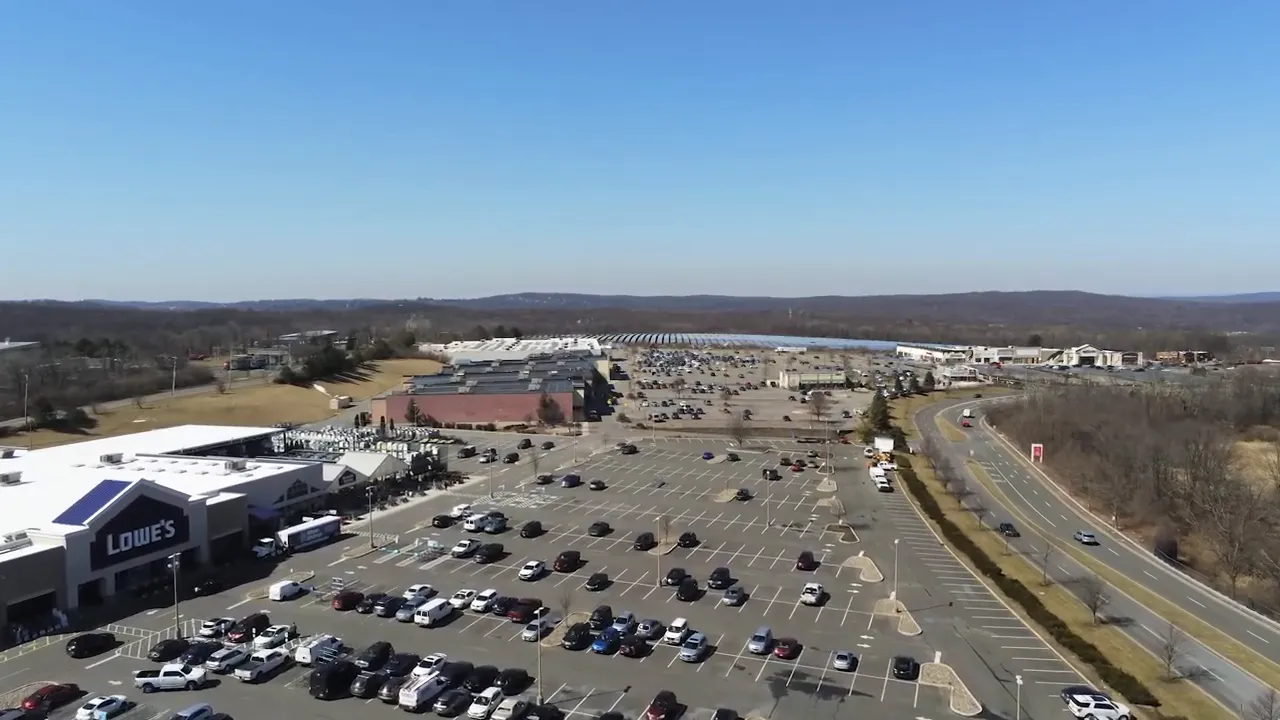 Clear aerial shot of a large shopping complex and parking lot near Roxbury New Jersey