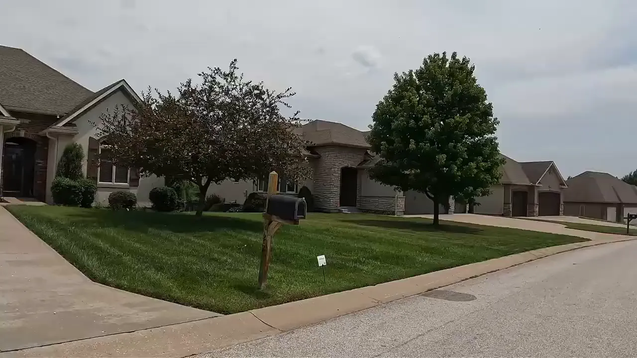 Cayhill neighborhood homes with trimmed lawns and consistent exterior appearance