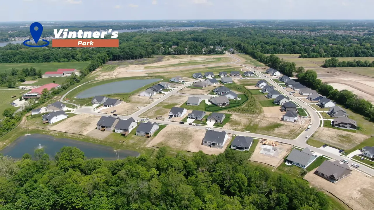 Aerial view of Vintner’s Park Estates showing homes and community pond near McCordsville IN